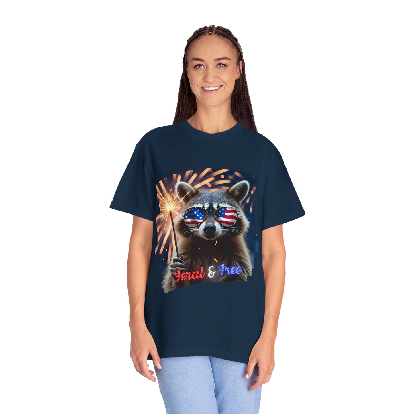 Stay wild in our “Feral & Free” tee! Featuring a raccoon rocking flag aviators, a sparkler in paw, and fireworks bursting behind—it’s pure chaotic patriotic energy for your summer vibe.