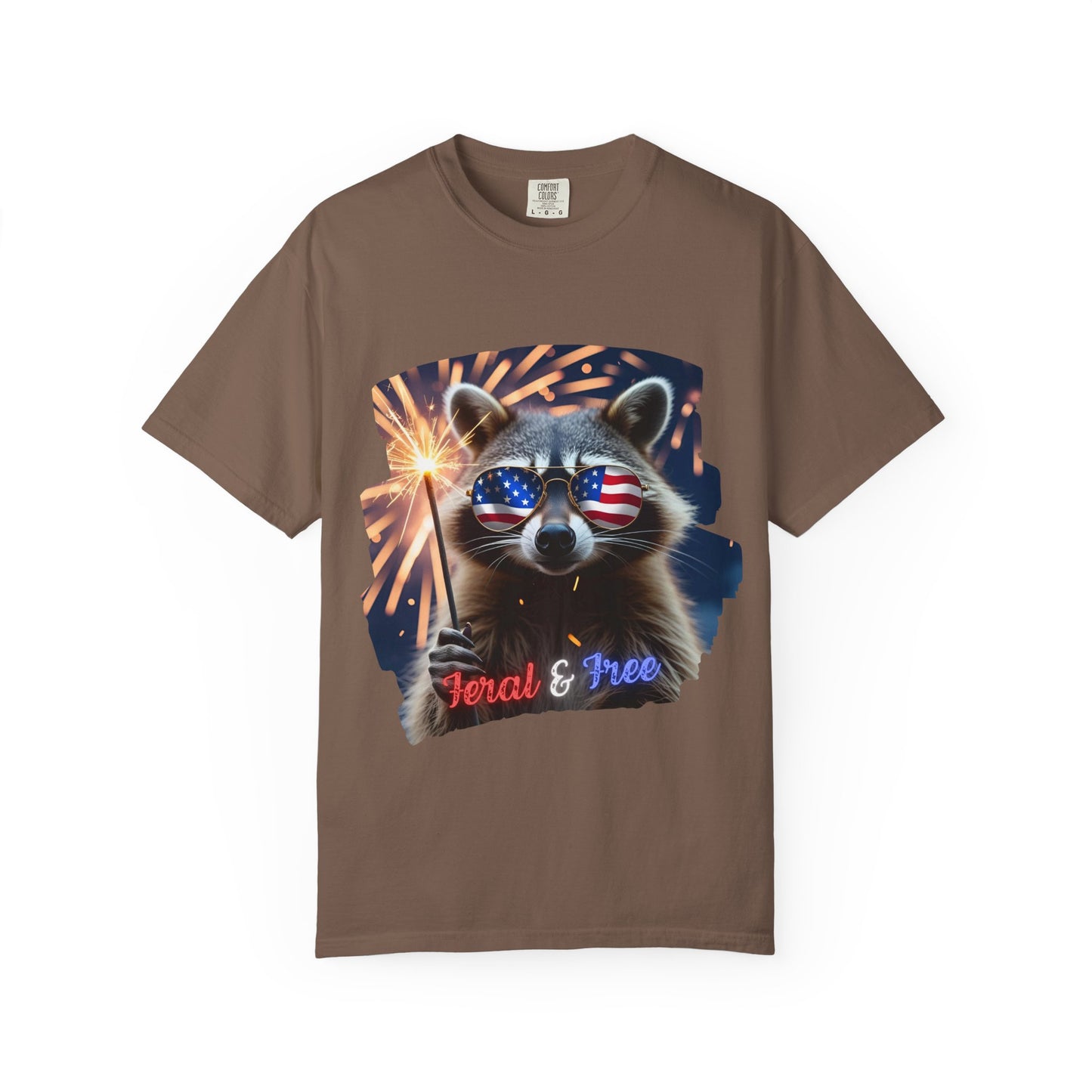 Stay wild in our “Feral & Free” tee! Featuring a raccoon rocking flag aviators, a sparkler in paw, and fireworks bursting behind—it’s pure chaotic patriotic energy for your summer vibe.