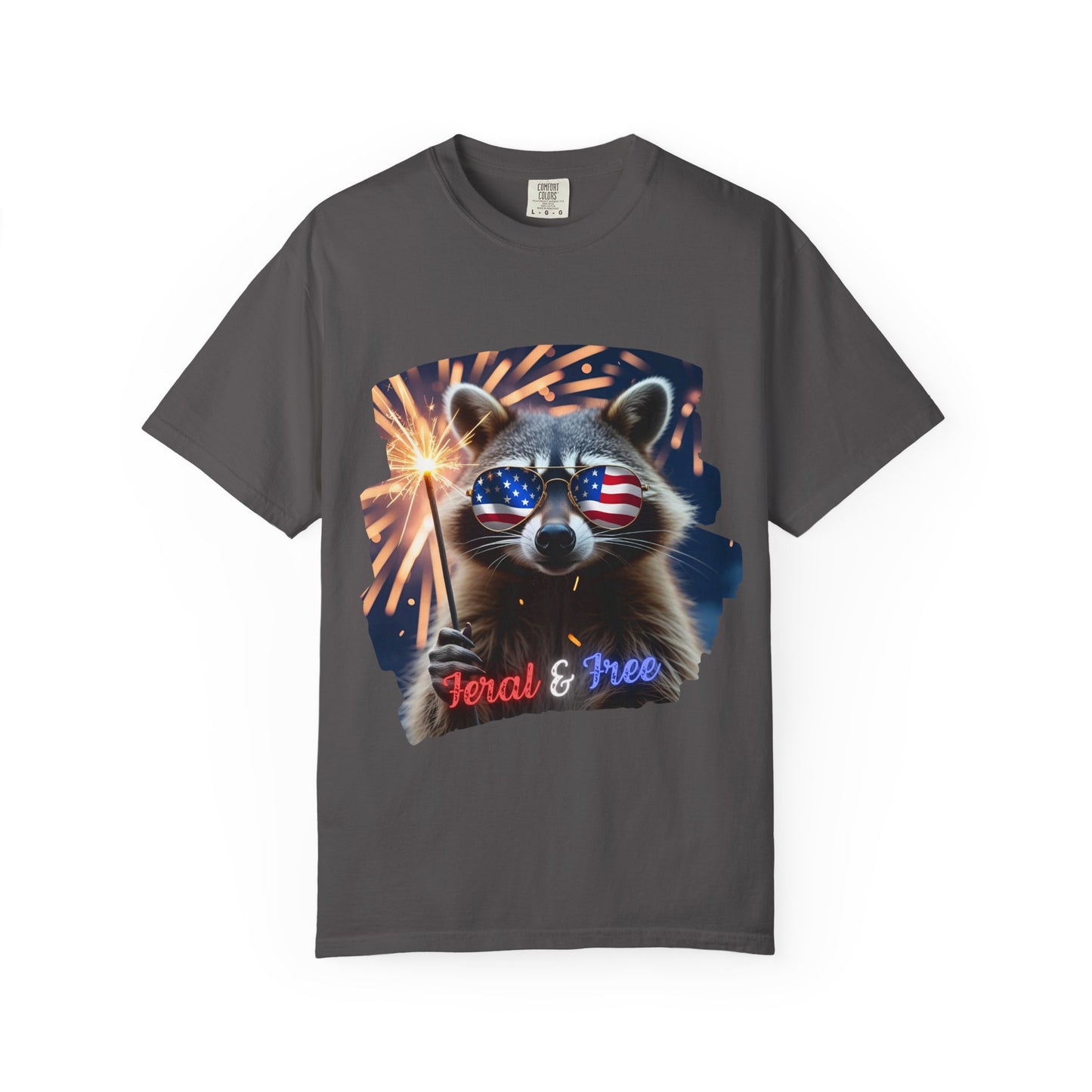 Stay wild in our “Feral & Free” tee! Featuring a raccoon rocking flag aviators, a sparkler in paw, and fireworks bursting behind—it’s pure chaotic patriotic energy for your summer vibe.