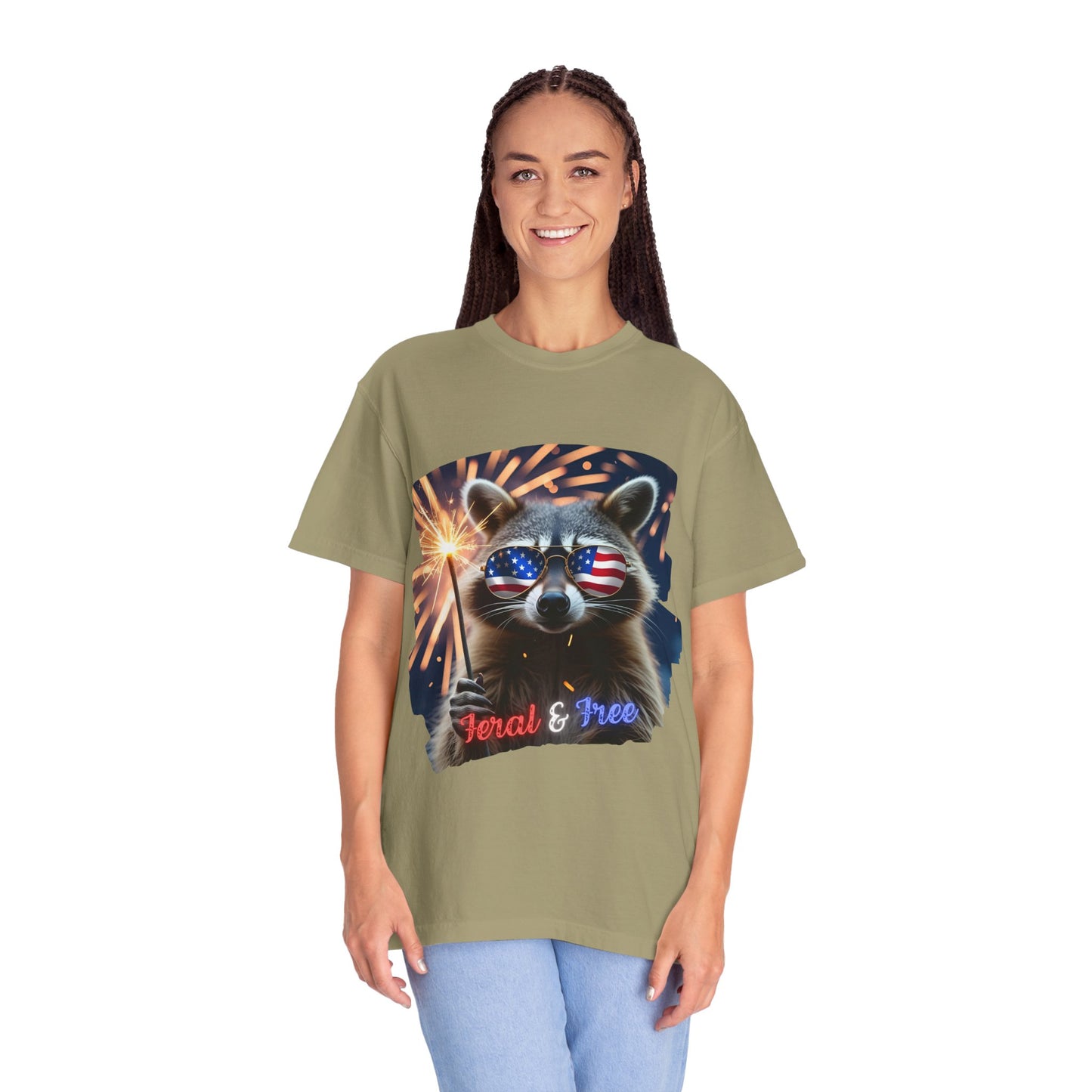 Stay wild in our “Feral & Free” tee! Featuring a raccoon rocking flag aviators, a sparkler in paw, and fireworks bursting behind—it’s pure chaotic patriotic energy for your summer vibe.