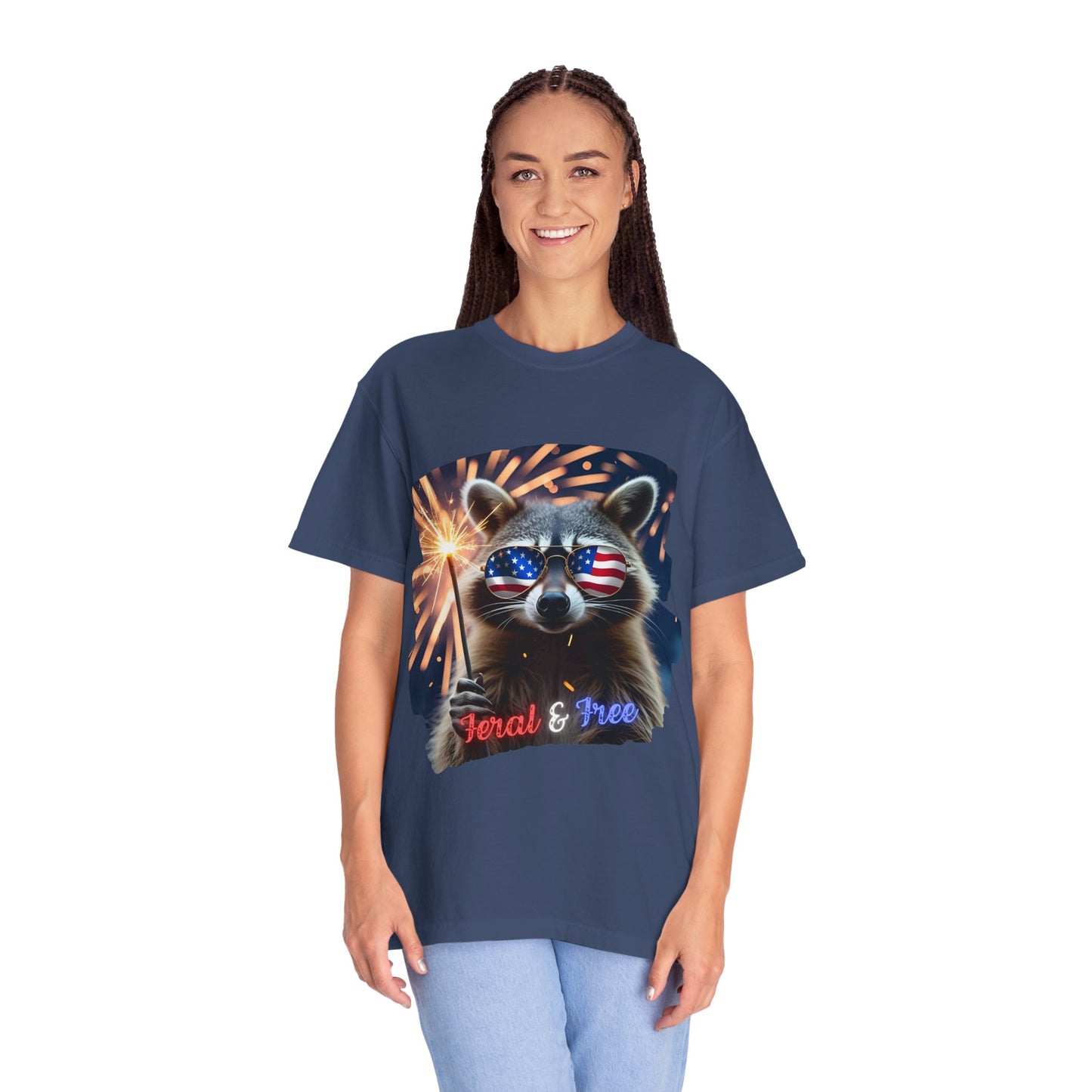 Stay wild in our “Feral & Free” tee! Featuring a raccoon rocking flag aviators, a sparkler in paw, and fireworks bursting behind—it’s pure chaotic patriotic energy for your summer vibe.