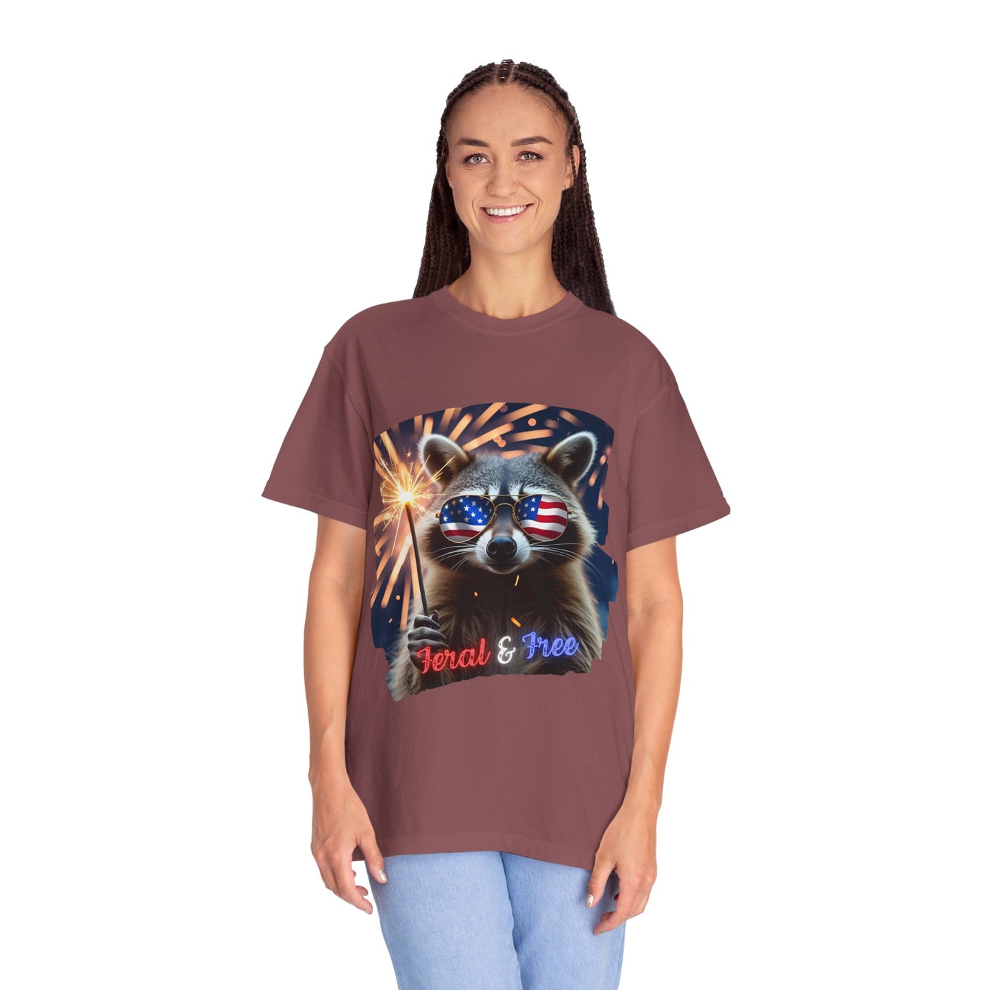 Stay wild in our “Feral & Free” tee! Featuring a raccoon rocking flag aviators, a sparkler in paw, and fireworks bursting behind—it’s pure chaotic patriotic energy for your summer vibe.