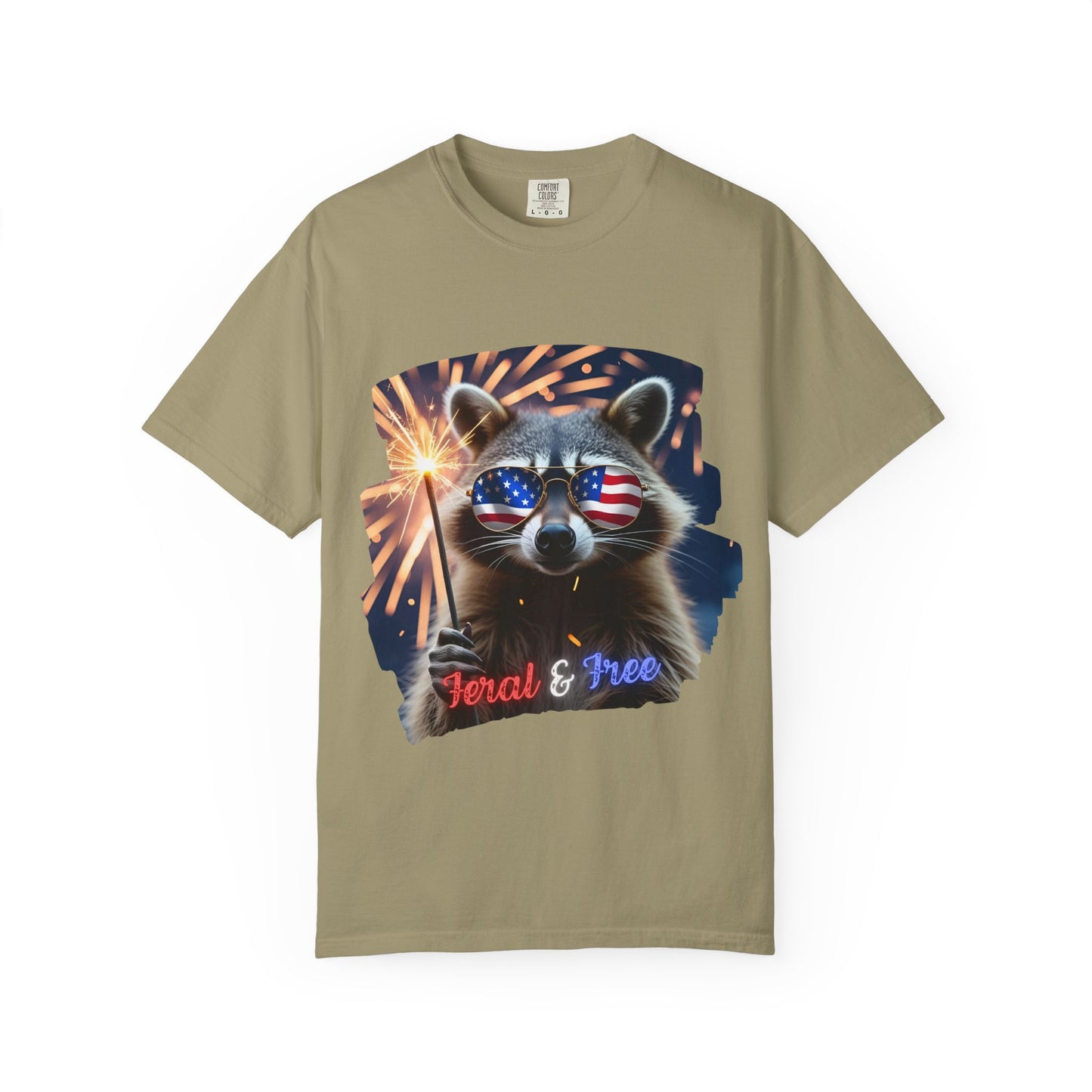 Stay wild in our “Feral & Free” tee! Featuring a raccoon rocking flag aviators, a sparkler in paw, and fireworks bursting behind—it’s pure chaotic patriotic energy for your summer vibe.