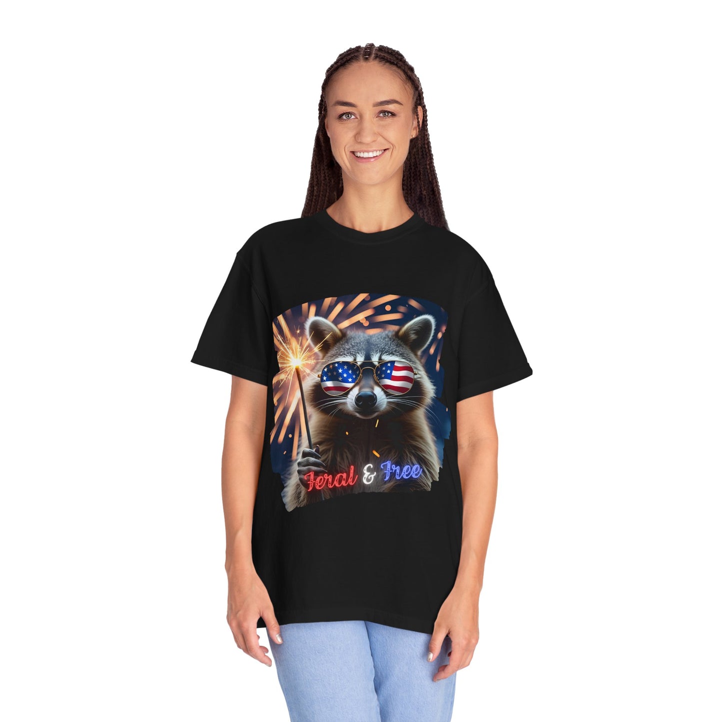 Stay wild in our “Feral & Free” tee! Featuring a raccoon rocking flag aviators, a sparkler in paw, and fireworks bursting behind—it’s pure chaotic patriotic energy for your summer vibe.