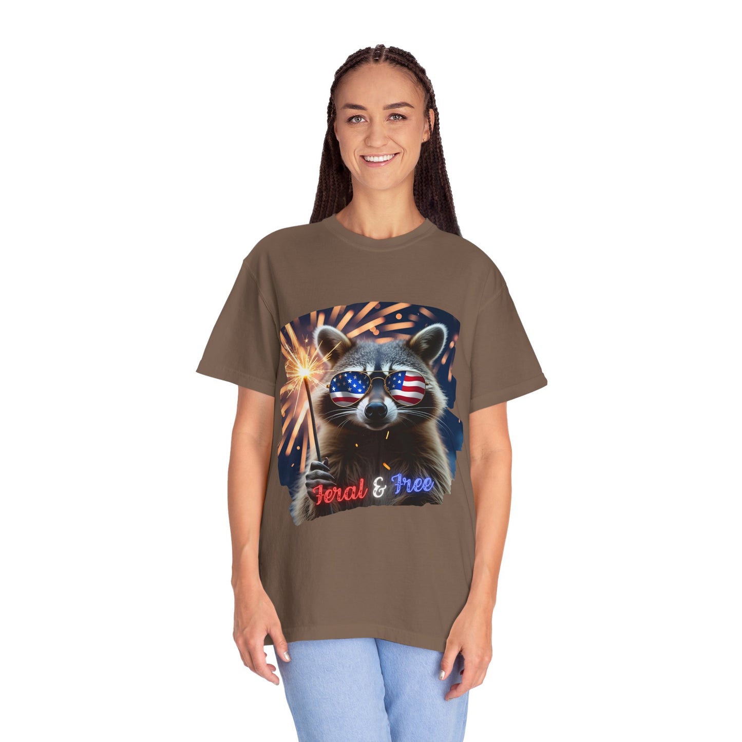 Stay wild in our “Feral & Free” tee! Featuring a raccoon rocking flag aviators, a sparkler in paw, and fireworks bursting behind—it’s pure chaotic patriotic energy for your summer vibe.