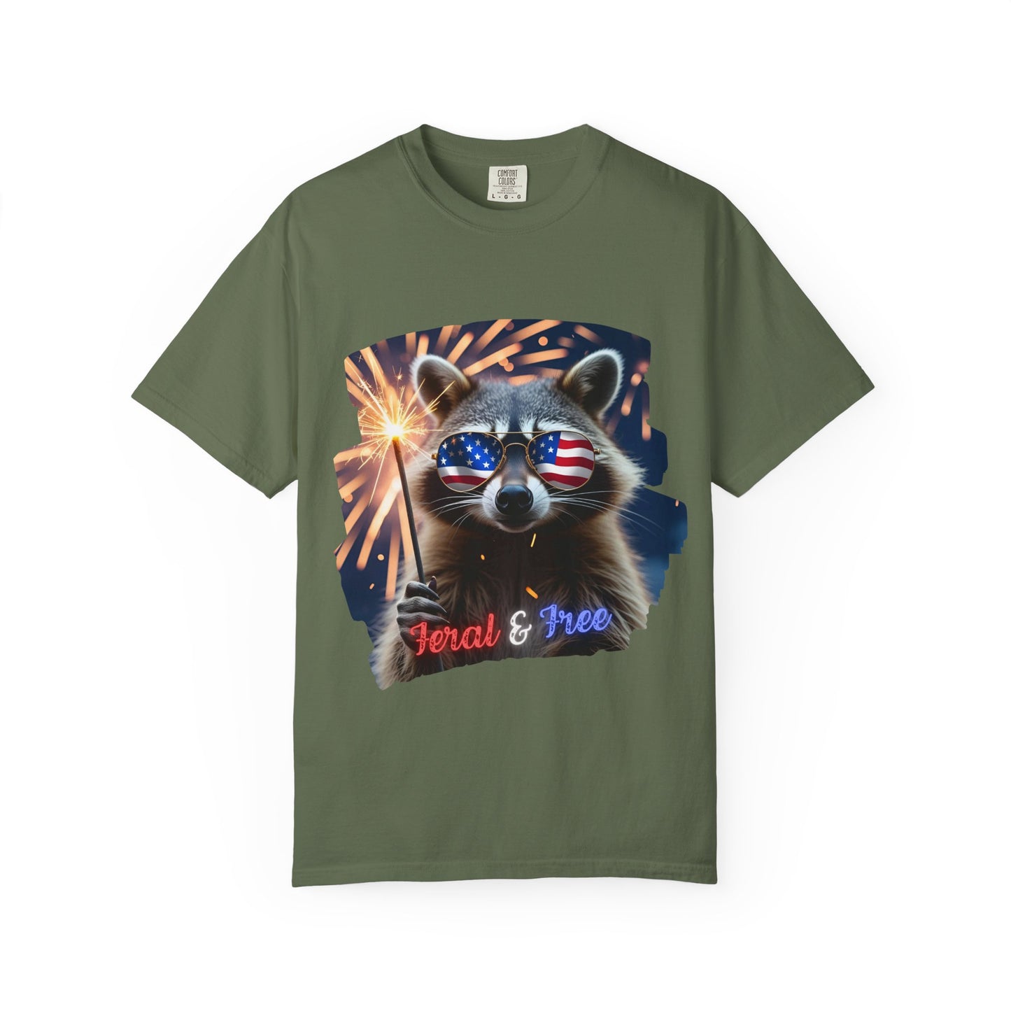 Stay wild in our “Feral & Free” tee! Featuring a raccoon rocking flag aviators, a sparkler in paw, and fireworks bursting behind—it’s pure chaotic patriotic energy for your summer vibe.