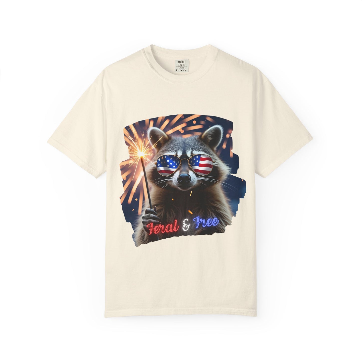 Stay wild in our “Feral & Free” tee! Featuring a raccoon rocking flag aviators, a sparkler in paw, and fireworks bursting behind—it’s pure chaotic patriotic energy for your summer vibe.