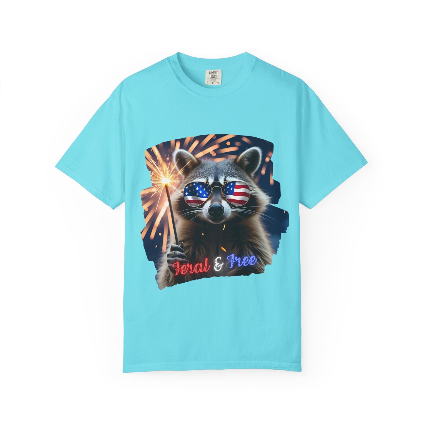 Stay wild in our “Feral & Free” tee! Featuring a raccoon rocking flag aviators, a sparkler in paw, and fireworks bursting behind—it’s pure chaotic patriotic energy for your summer vibe.