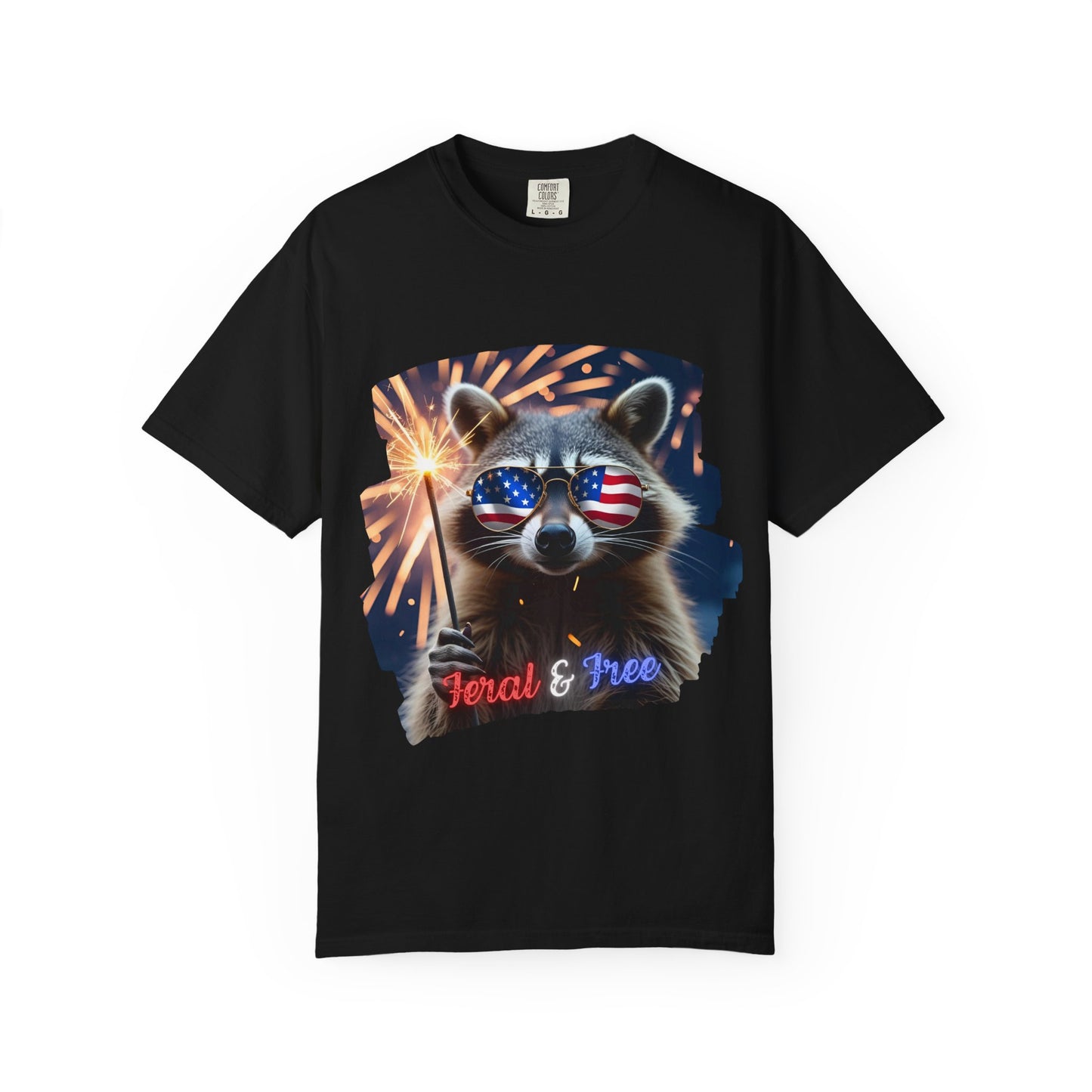 Stay wild in our “Feral & Free” tee! Featuring a raccoon rocking flag aviators, a sparkler in paw, and fireworks bursting behind—it’s pure chaotic patriotic energy for your summer vibe.