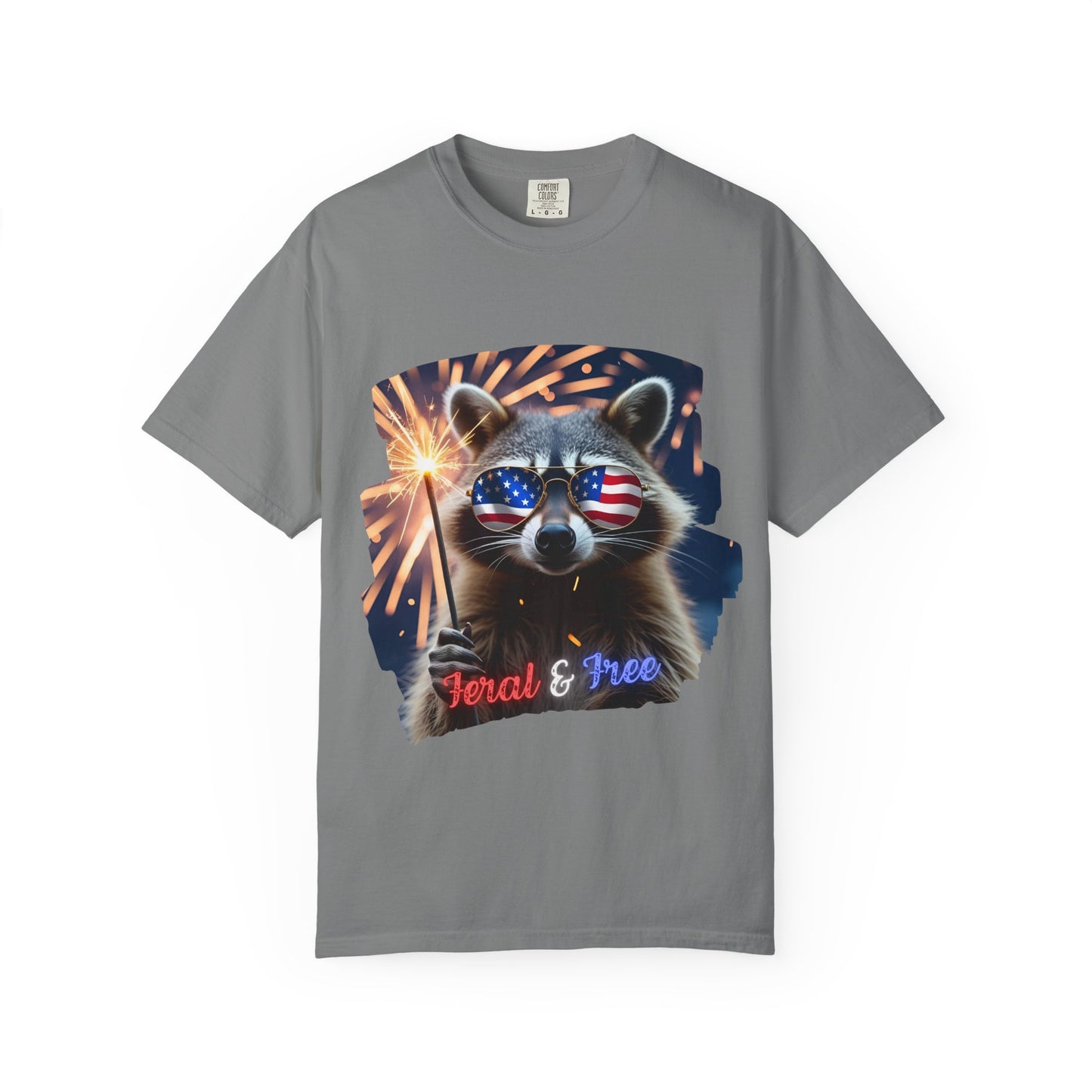Stay wild in our “Feral & Free” tee! Featuring a raccoon rocking flag aviators, a sparkler in paw, and fireworks bursting behind—it’s pure chaotic patriotic energy for your summer vibe.