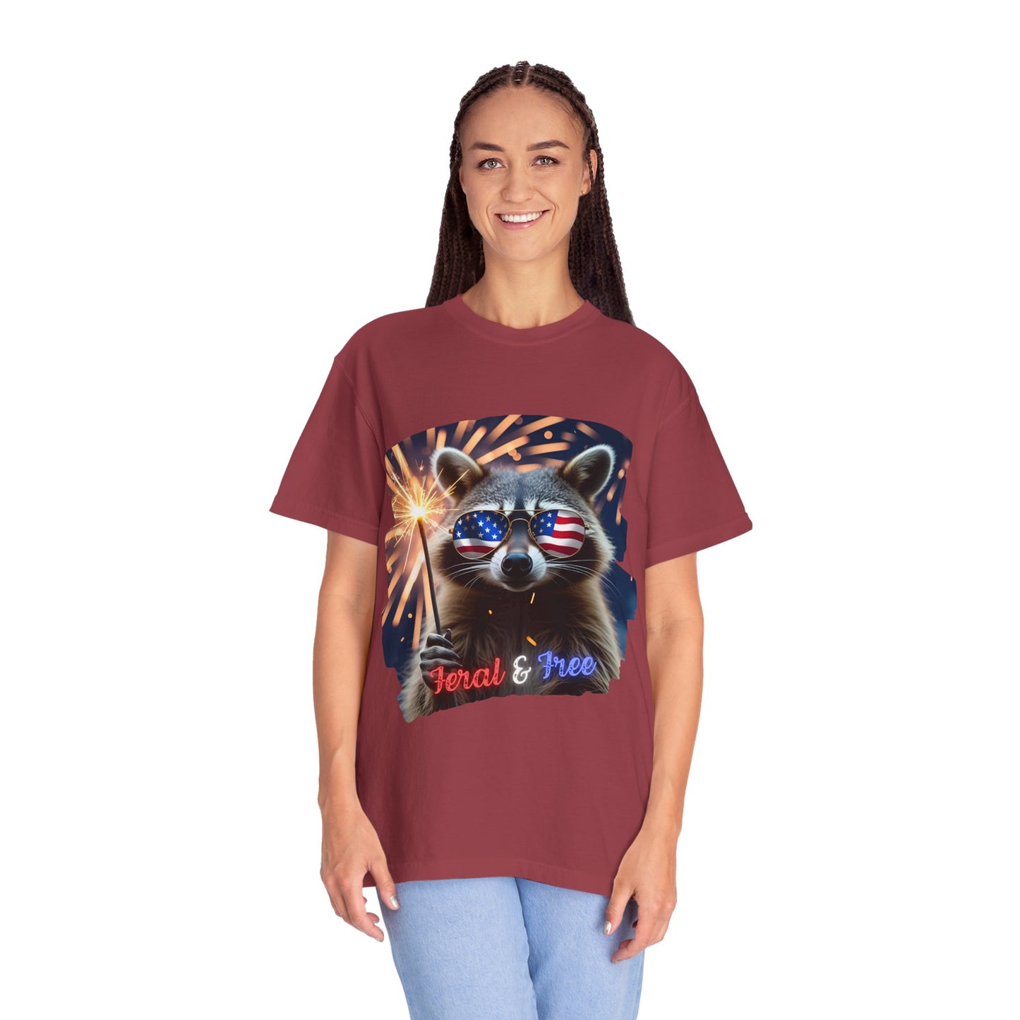 Stay wild in our “Feral & Free” tee! Featuring a raccoon rocking flag aviators, a sparkler in paw, and fireworks bursting behind—it’s pure chaotic patriotic energy for your summer vibe.
