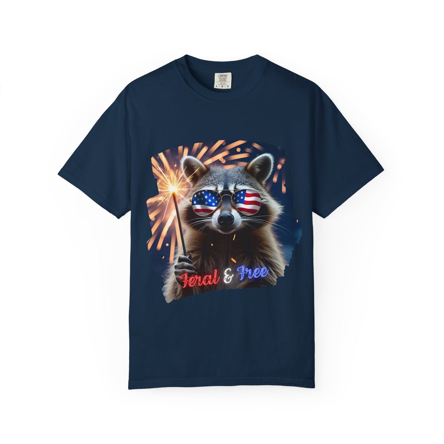 Stay wild in our “Feral & Free” tee! Featuring a raccoon rocking flag aviators, a sparkler in paw, and fireworks bursting behind—it’s pure chaotic patriotic energy for your summer vibe.