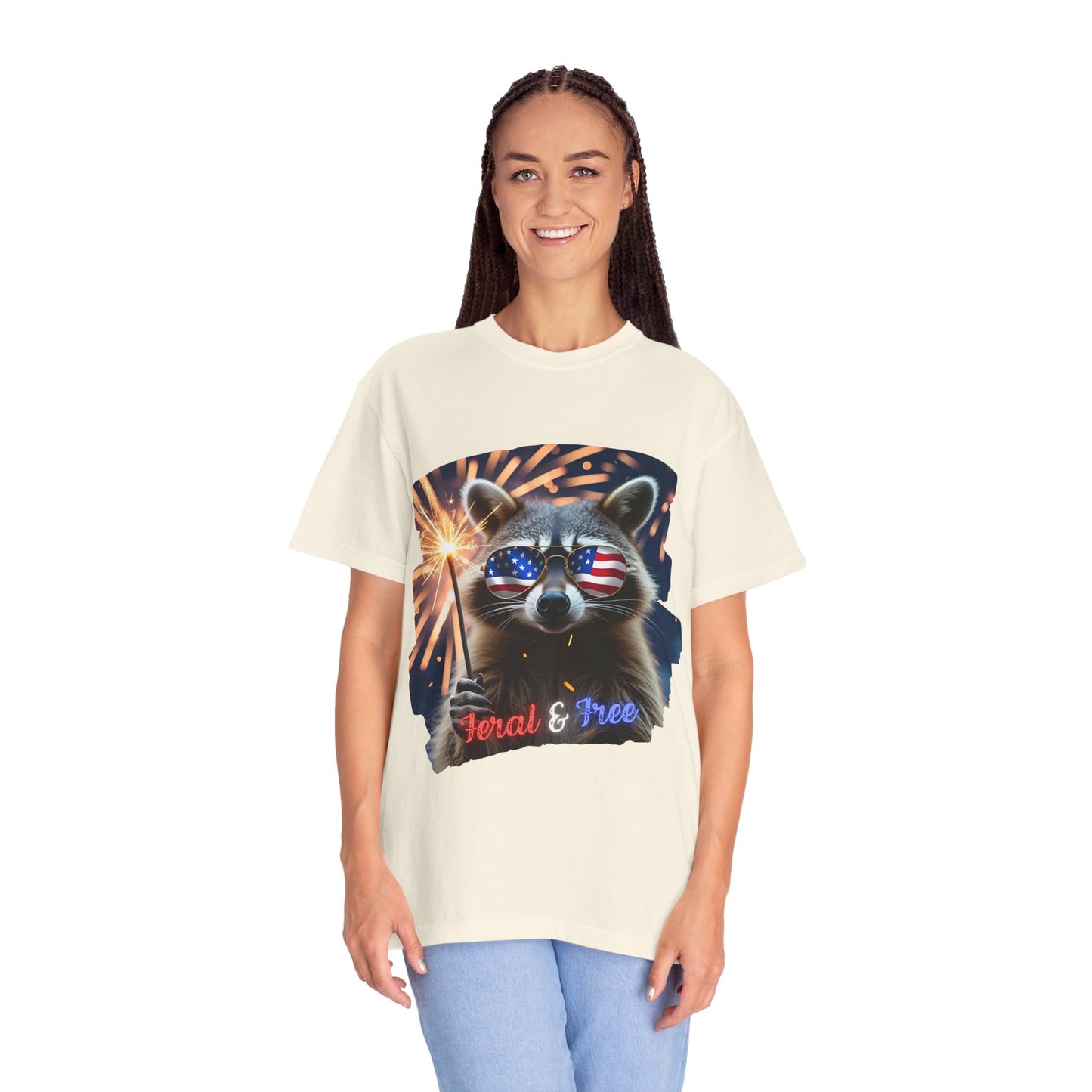 Stay wild in our “Feral & Free” tee! Featuring a raccoon rocking flag aviators, a sparkler in paw, and fireworks bursting behind—it’s pure chaotic patriotic energy for your summer vibe.