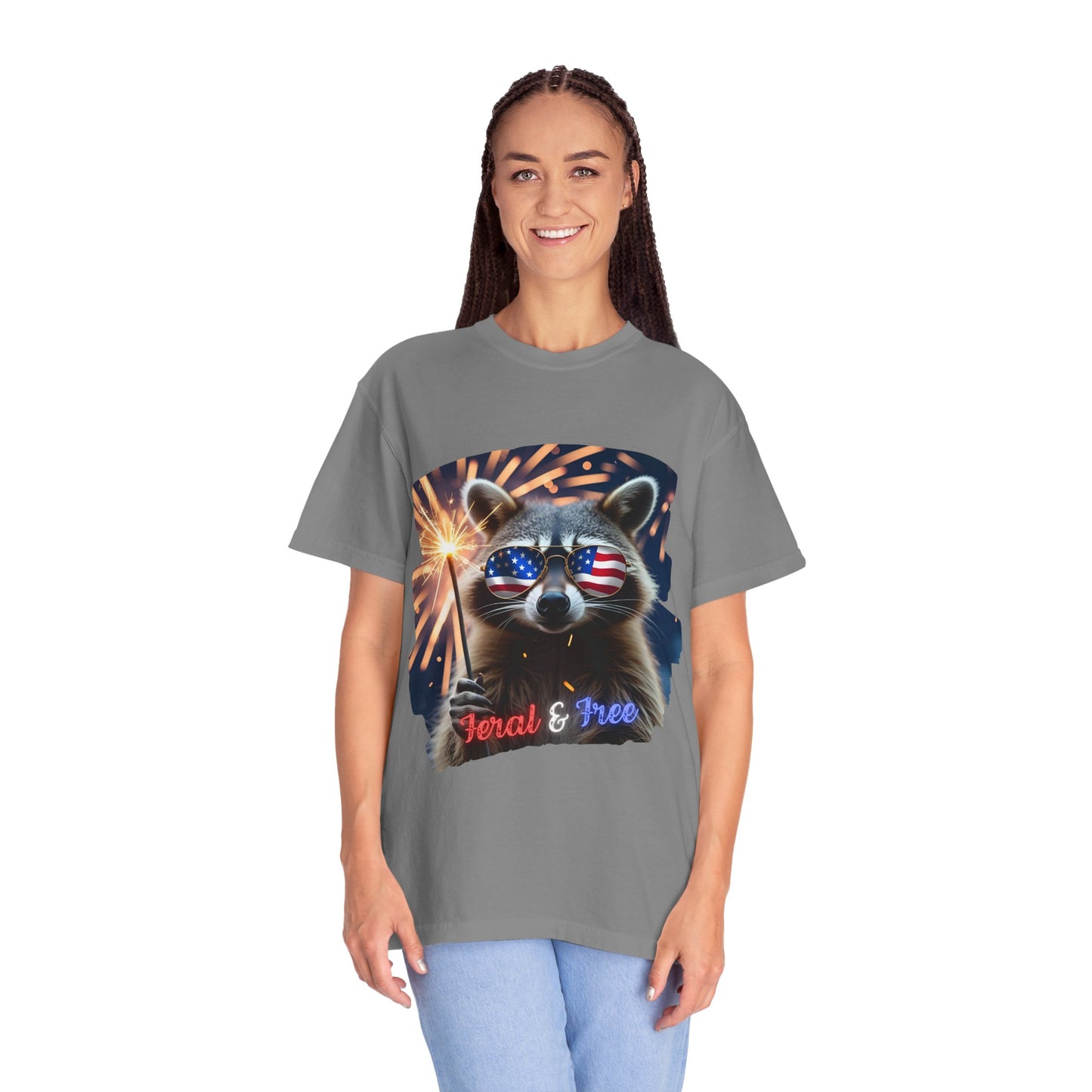 Stay wild in our “Feral & Free” tee! Featuring a raccoon rocking flag aviators, a sparkler in paw, and fireworks bursting behind—it’s pure chaotic patriotic energy for your summer vibe.